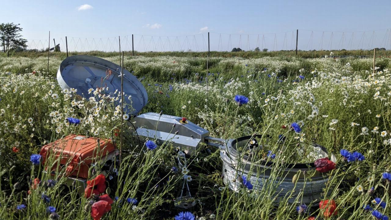 Equipment for measuring greenhouse gas emissions within a field of flowers. 